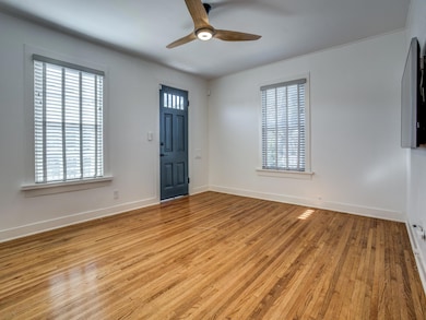 Entryway with baseboards, light wood-style floors,