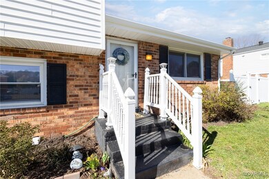 Entrance to property with brick siding