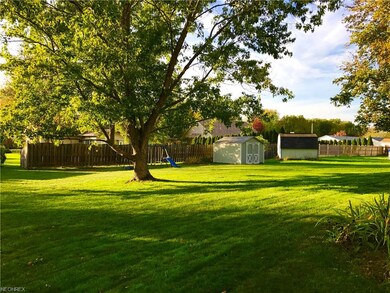 Large backyard with shed.
