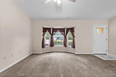 Living Room w/ Vaulted Ceiling and Bay Windows