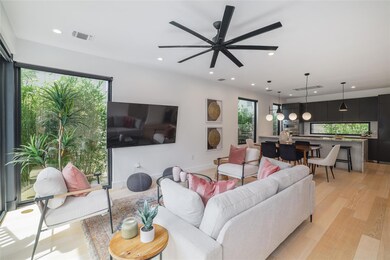 Living area with recessed lighting, a ceiling fan