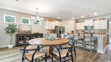 Dining area with light hardwood / wood-style floor