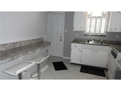 Kitchen. Ceramic tile floor, breakfast bar and sto