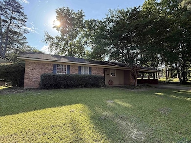Ranch-style home with a front yard