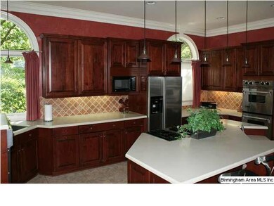 View of kitchen w/beautiful cherry cabinets & trav