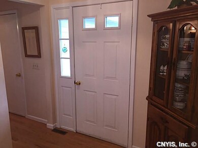 Foyer. Neutral colors an beautiful hardwood floors.