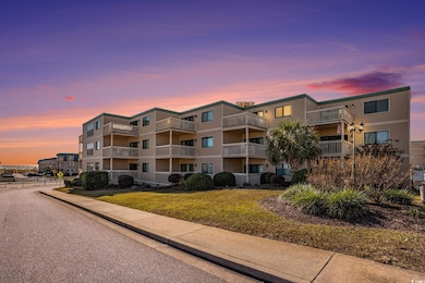 View of property at dusk