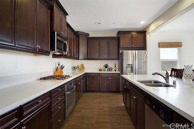 Dark Wood Stained Cabinets with Lots of Counter Sp