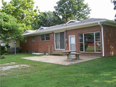 Enjoy the beautifully landscaped backyard from the open patio