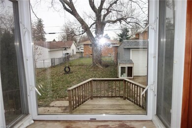 Greenhouse window from kitchen overlooking backyard
