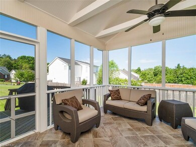Beautiful screened in porch with ceiling fan.
