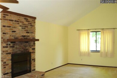 Living Room with Brick Fireplace and Newer Glass D