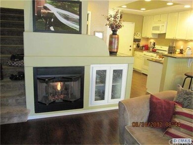 UPGRADED LIVING ROOM WITH DRAMATIC FIREPLACE