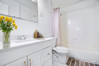 Full bathroom featuring vanity, shower / bath comb