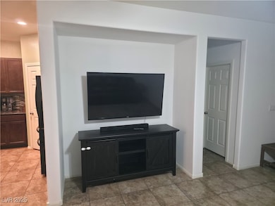 Detailed view of tasteful backsplash and freestanding refrigerator