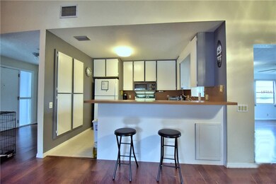 Kitchen overlooks the living room.