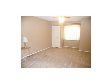 Sitting Room Has Warm Neutral Decor, Closet and Ac