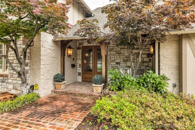 View of exterior entry with french doors and stone