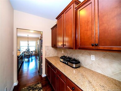 Beautiful butler pass between the dining room and open kitchen. More cabinets, more serving space...just WoW!!