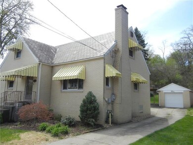 Home Showing Large Driveway and Garage