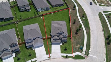 This home sits on a large corner lot with ample yard space in front and the back, lush landscaping and a well-maintained yard.