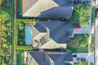 Aerial showcasing this stunning Ashton Woods home situated on an oversized lot boasts with details and privacy!