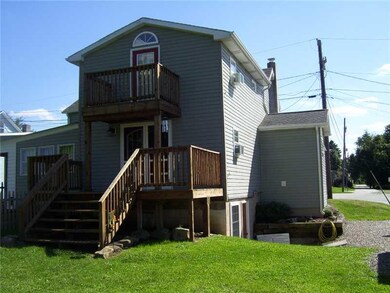 Exterior Back. REAR OF HOME WITH 2 DECKS FROM DINI