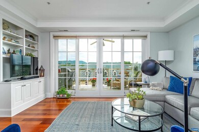 Floor to ceiling doors open to a large balcony and