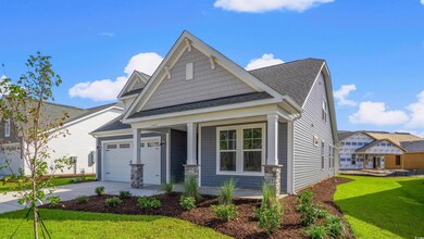 Craftsman-style home featuring roof with shingles, a porch, a front lawn, concrete driveway, and a garage