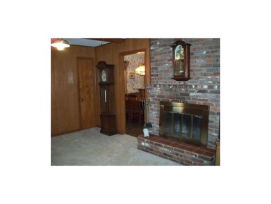 Wood burning fireplace in the first floor family r