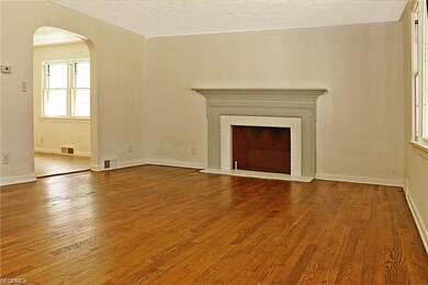 Living Room with fireplace. Refinished hardwood fl