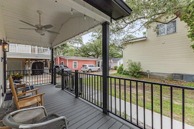 Wooden terrace featuring ceiling fan