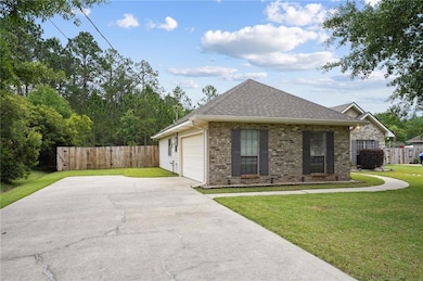 Long driveway with 2 car garage & rear yard access