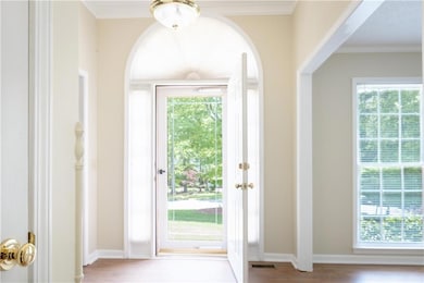 Entryway with ornamental molding, a wealth of natu