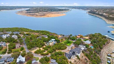 Aerial view of residential area featuring a nearby body of water