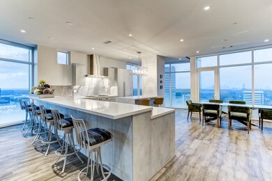 The long KITCHEN PENINSULA easily seats six and gr