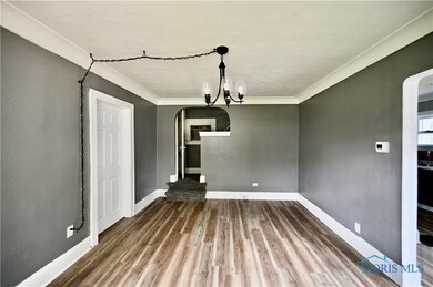 Living Room w/ new floors, paint, & light