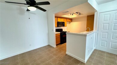 Kitchen with visible vents, baseboards, a raised c
