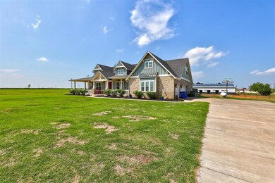 Craftsman house with a front lawn