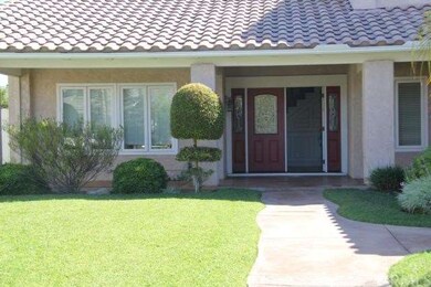 Double Door Entrance and Expansive Front Porch