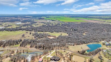 Birds eye view of property with a water view and a