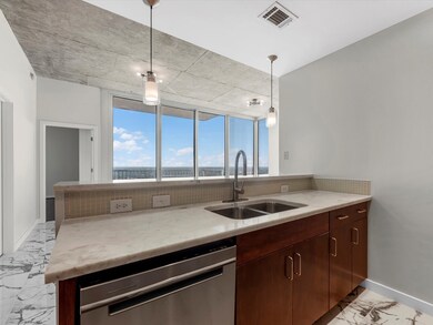 The kitchen opens to the inviting family room acro