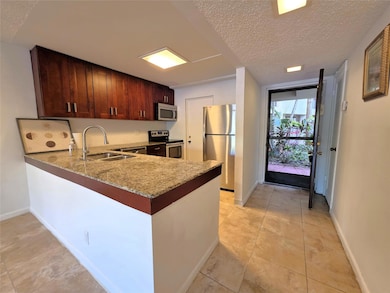 Cypress Bend unit 106, Pompano Beach, FL 33069 - photo 2
