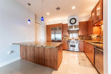 Beautiful kitchen open to living area.