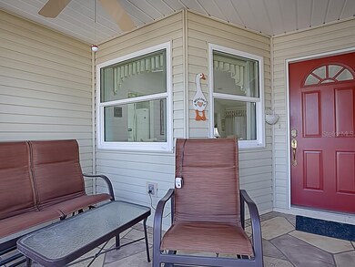 ENJOY MORNING COFFEE AND THE PAPER ON THIS ENCLOSED PORCH!