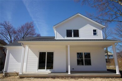 View from the back of the home with a large porch