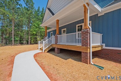 Doorway to property featuring board and batten siding and covered porch