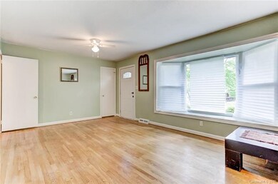 Family room with bay window overlooking front yard