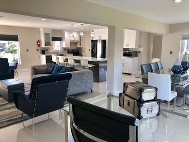 LIVING, DINING WITH KITCHEN IN BKGD