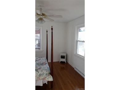 Master bedroom has beautifully refinished oak floo